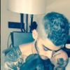 Zayn Malik Holding Puppies and Shirtless?!
